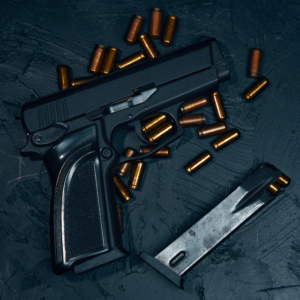 A handgun sitting on a table with bullets close by in a demonstration for the concealed carry class hosted by Guardian.