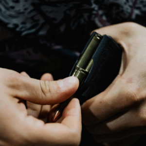 A man loads ammunition into a magazine after a concealed carry course with Guardian.